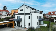 Neubau EBZ: attraktive Gartenwohnung mit Süd-West Garten und Terrasse in bester Lage in Karlsfeld! - Hausansicht SW