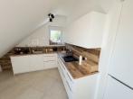 Neuwertige, edle 2-Zimmer-Dachgeschosswohnung mit Süd-West-Terrasse in Olching - Neu-Esting - Küche
