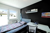 Schlafzimmer 2 im 1. OG
