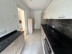 NEUBAU Erstbezug: Schicke sonnige 3 Zimmer Wohnung mit Süd- und Westbalkon in guter Lage Hadern ! - Einbauküche mit Schiebetüre zum Wohnbereich