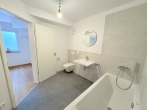 ERSTBEZUG: Bestlage in Karlsfeld- hochwertige, sonnige Neubau-Gartenwohnung mit Süd/West Terrasse! - Bad UG