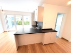 ERSTBEZUG: Bestlage in Karlsfeld- hochwertige, sonnige Neubau-Gartenwohnung mit Süd/West Terrasse! - Einbauküche mit Theke