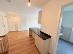 ERSTBEZUG: Bestlage in Karlsfeld- hochwertige, sonnige Neubau-Gartenwohnung mit Süd/West Terrasse! - Teil v. Wohnbereich