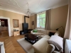 ALSAOL Immobilien: Stylische 3-Zimmer-Jugendstilwohnung in Bestlage Schwabing! - Wohnzimmer mit Kamin